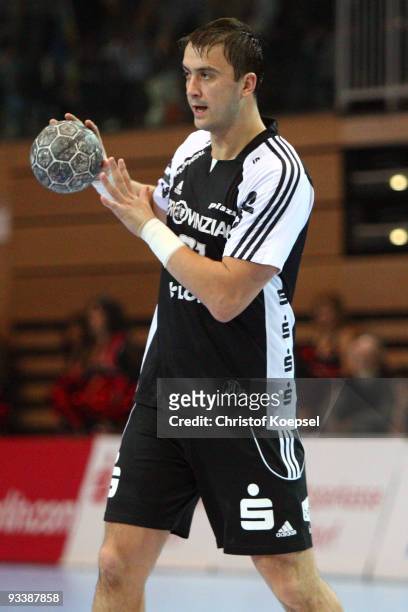 Momir Ilic of Kiel passes the ball during the Toyota Handball Bundesliga match between HSG Duesseldorf and THW Kiel at the Burg-Waechter Castello on...