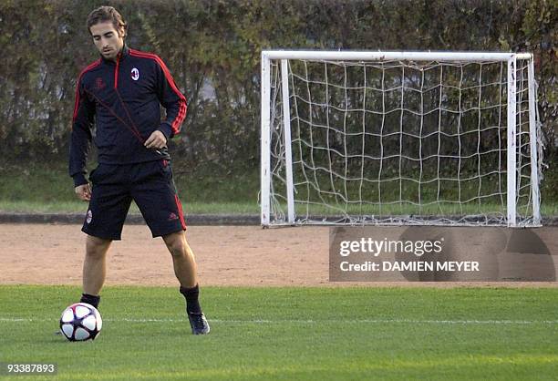 Milan's French midfielder Mathieu Flamini takes part in a training session on the eve of his team's UEFA Champions League group stage football match...
