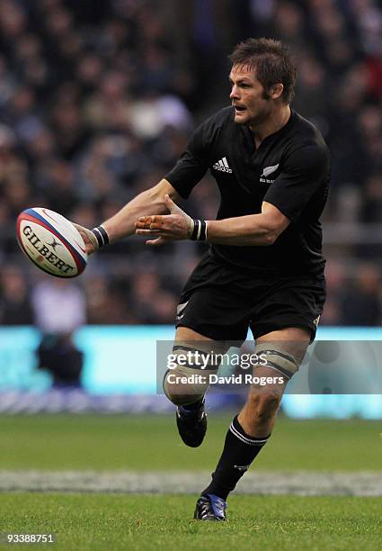 Richie McCaw of New Zealand passes the ball during the Investec Challenge Series match between England and New Zealand at Twickenham on November 21,...