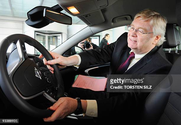 General Motors Europe interim chairman Nick Reilly sits in a Opel Insignia car after talks with Thuringia's State Premier Christine Lieberknecht at...