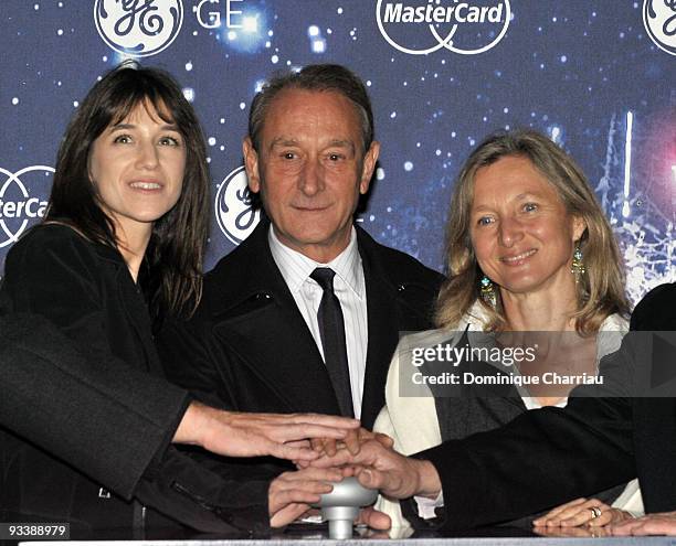 French Actress Charlotte Gainsbourg, Mayor of Paris Bertrand Delanoe and President of General Electric France Clara Gaymard attend the switching on...