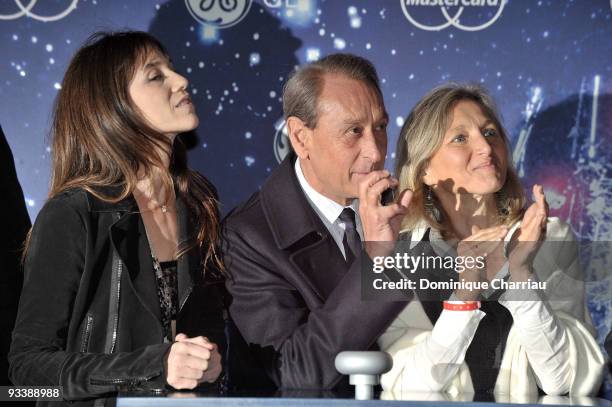 French Actress Charlotte Gainsbourg, Mayor of Paris Bertrand Delanoe and President of General Electric France Clara Gaymard attend the switching on...