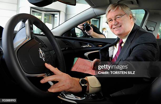 General Motors Europe interim chairman Nick Reilly sits in a Opel Insignia car after talks with Thuringia's State Premier Christine Lieberknecht at...