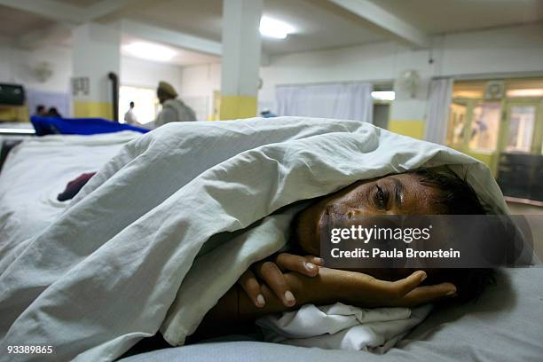 Ezatullah from Jalalabad rests on his bed at the International Red Cross Orthopedic rehabilitation center November 23, 2009 Kabul, Afghanistan....