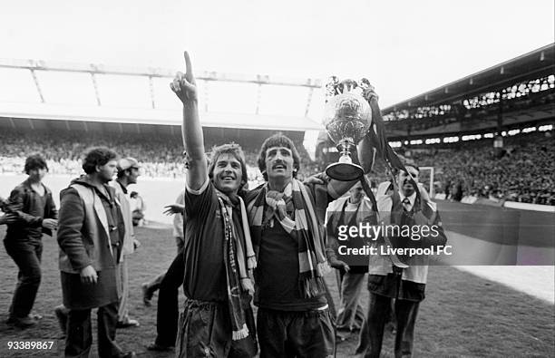 Liverpool players Kenny Dalglish and David Johnson hold the Football League Division One trophy after the Football League Division One match between...