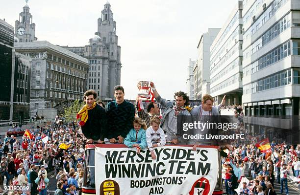 Liverpool players Jim Beglin, Ian Rush, Bruce Grobbelaar, Craig Johnston and Steve McMahon celebrate being the FA Cup and Canon League Division One...