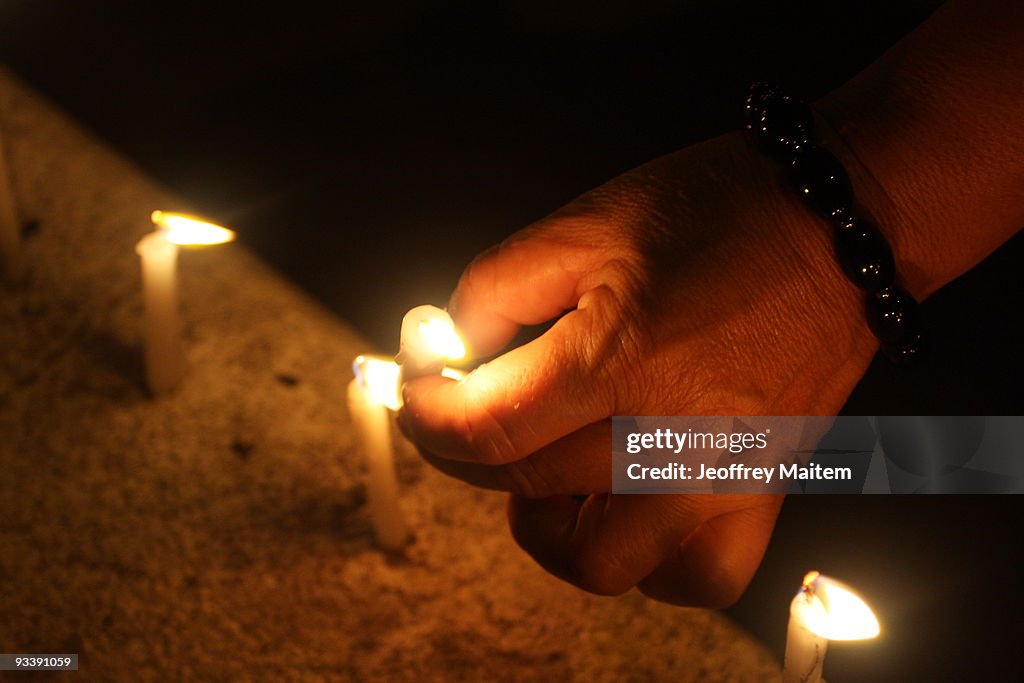 Candles Lit For Victims of Philippine Massacre