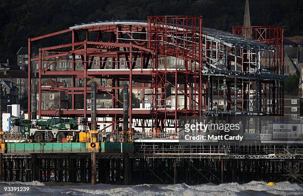 Waves break beneath the new steel framework of Weston-Super-Mare's Grand Pier on November 25, 2009 in Weston-Super-Mare, England. Although the recent...