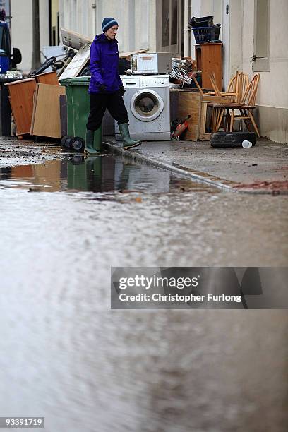 Woman surveys the damage to her possessions outside her home in the wake of last weeks devastating floods in Cumbria on November 25, 2009 in...