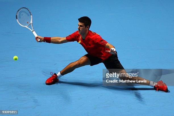 Novak Djokovic of Serbia returns the ball during the men's singles first round match against Robin Soderling of Sweden during the Barclays ATP World...