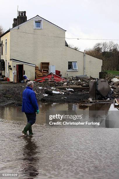 Residents survey their water damaged belongings in the wake of last weeks devastating floods in Cumbria on November 25, 2009 in Cockermouth, England....