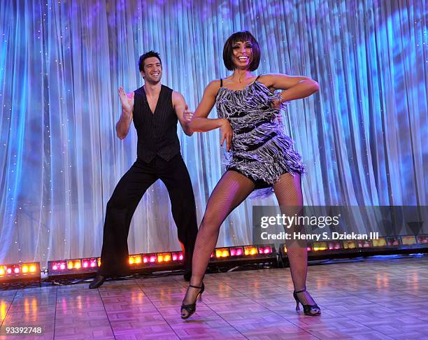 Singer Mya and Dmitry Chaplin dancing on ABC's "Good Morning America" at ABC Studios on November 25, 2009 in New York City.