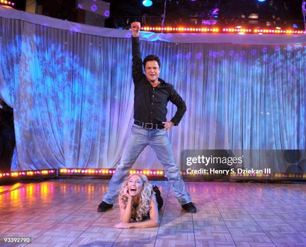 Entertainer Donny Osmond and Kym Johnson dancing on ABC's "Good Morning America" at ABC Studios on November 25, 2009 in New York City.