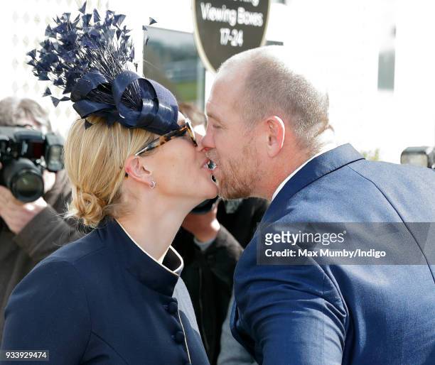 Zara Phillips kisses husband Mike Tindall as they attend day 4 'Gold Cup Day' of the Cheltenham Festival at Cheltenham Racecourse on March 16, 2018...