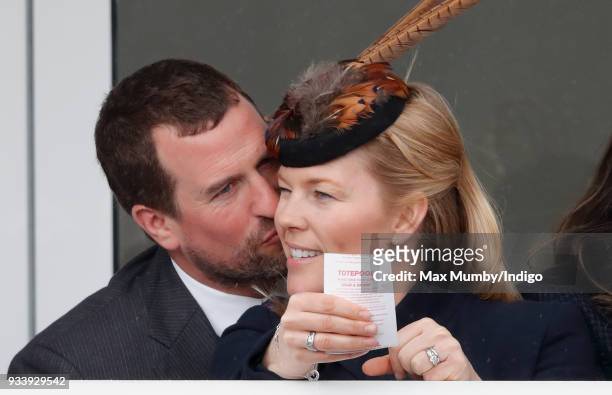 Peter Phillips kisses wife Autumn Phillips as they attend day 4 'Gold Cup Day' of the Cheltenham Festival at Cheltenham Racecourse on March 16, 2018...