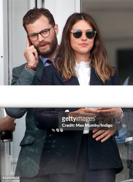 Jamie Dornan and Amelia Warner attend day 4 'Gold Cup Day' of the Cheltenham Festival at Cheltenham Racecourse on March 16, 2018 in Cheltenham,...