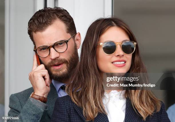Jamie Dornan and Amelia Warner attend day 4 'Gold Cup Day' of the Cheltenham Festival at Cheltenham Racecourse on March 16, 2018 in Cheltenham,...