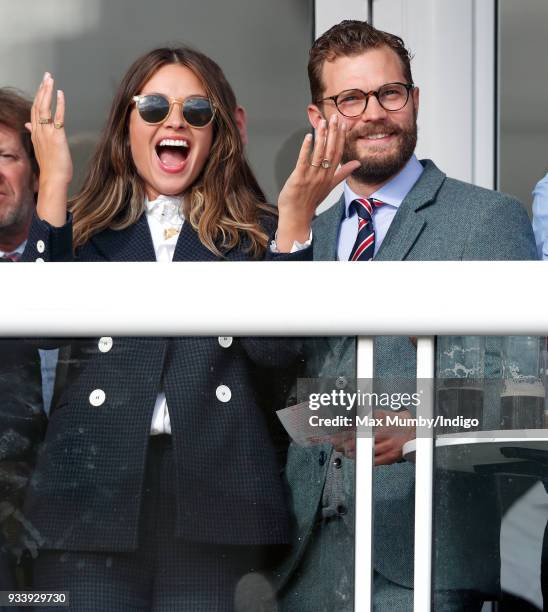 Amelia Warner and Jamie Dornan attend day 4 'Gold Cup Day' of the Cheltenham Festival at Cheltenham Racecourse on March 16, 2018 in Cheltenham,...