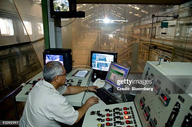 Osvaldo Chagas operates the control room of sugarcane unloading and crushing at the Pedra Agroindustrial S/A Usina de Pedra ethanol plant near...