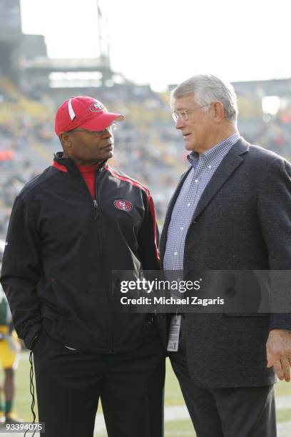 Head coach Mike Singletary of the San Francisco 49ers talks with Dan Reeves on the field prior to the NFL game against the Green Bay Packers at...