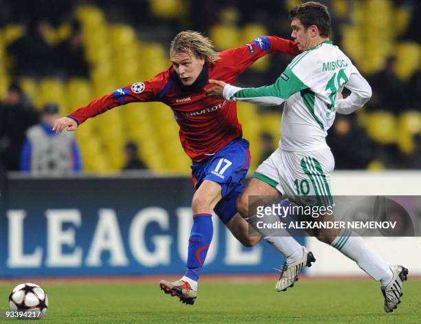 Zvjezdan Misimovic of Wolfsburg fights for the ball with Milos Krasic of CSKA Moscow in Moscow on November 25, 2009 during the UEFA Champions League...