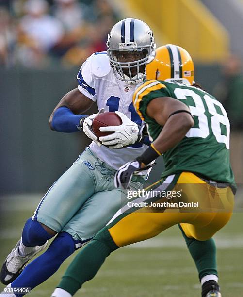 Roy Williams of the Dallas Cowboysmoves against Tramon Williams of the Green Bay Packers at Lambeau Field on November 15, 2009 in Green Bay,...