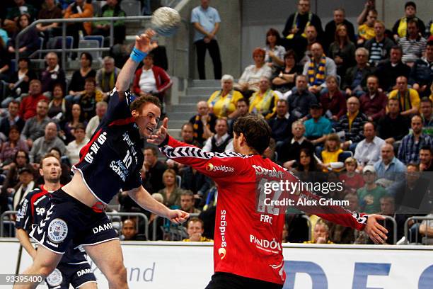 Thomas Mogensen of Flensburg-Handewitt tries to score against goalkeeper Henning Fritz of Rhein-Neckar Loewen during the Toyota Handball Bundesliga...