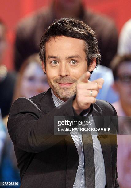French journalist and TV host Yann Barthes speaks during the recording of "Le Grand journal" news program on Canal + TV channel on November 25, 2009...