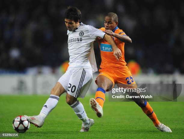 Deco of Chelsea goes holds off Fernando Reges of FC Porto during the UEFA Champions League Group D match between FC Porto and Chelsea at the Estadio...