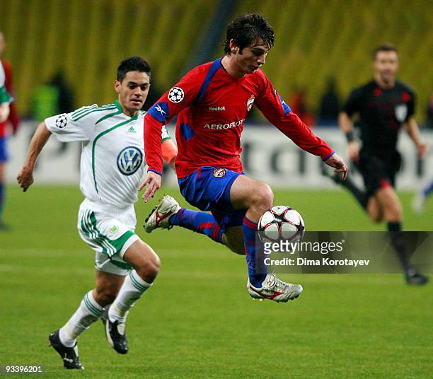 Alan Dzagoev of CSKA Moscow fights for the ball with Josue of VfL Wolfsburg during the UEFA Champions League group B match between CSKA Moscow and...