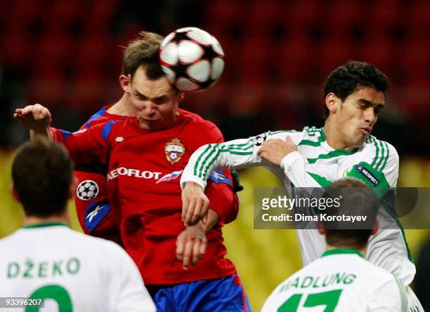 Sergei Ignashevich of CSKA Moscow fights for the ball with Ricardo Costa of VfL Wolfsburg during the UEFA Champions League group B match between CSKA...
