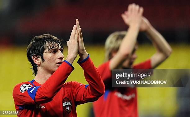 Alan Dzagoev and Milos Krasic of CSKA Moskva celebrate their victory over WfL Wolfsburg during the Champions League Group B football match in Moscow...