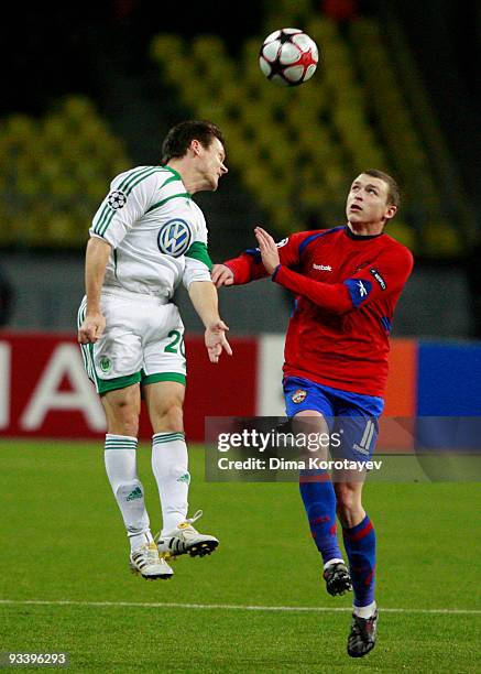 Pavel Mamaev of CSKA Moscow fights for the ball with Sascha Riether of VfL Wolfsburg during the UEFA Champions League group B match between CSKA...