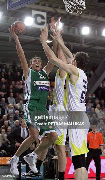 Zalgiris Kaunas' Dainius Salenga vies with Fenerbahce's Ulker Omer Asik during their Euroleague basketball Championship match in Kaunas, Lithuania,...