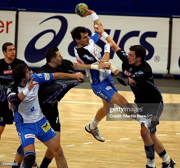 Krysztof Lijewski of Hamburg is blocked by Michael Wittig of Dormagen during the Bundesliga match between HSV Hamburg and TSV Dormagen at the Color...