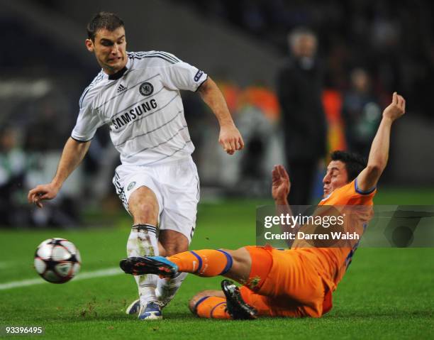 Branislav Ivanovic of Chelsea is tackled by Cristian Rodriguez of FC Porto during the UEFA Champions League Group D match between FC Porto and...