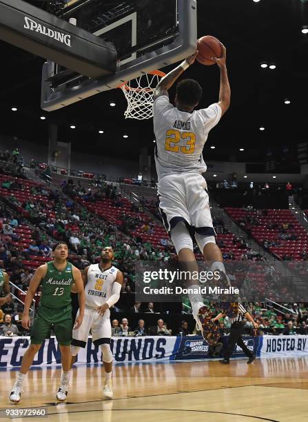 Esa Ahmad of the West Virginia Mountaineers dunks against the Marshall Thundering Herd in the second half during the second round of the 2018 NCAA...