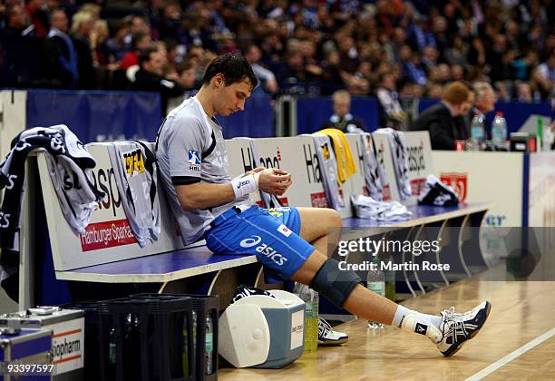 Krysztof Lijewski of Hamburg sits injured on the bench during the Bundesliga match between HSV Hamburg and TSV Dormagen at the Color Line Arena on...