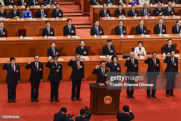 Newly elected state councilors Zhao Kezhi , Wang Yi, Wei Fenghe, Vice Premier Hu Chunhua, Sun Chunlan, Liu He, and state councillors Wang Yong, Xiao...