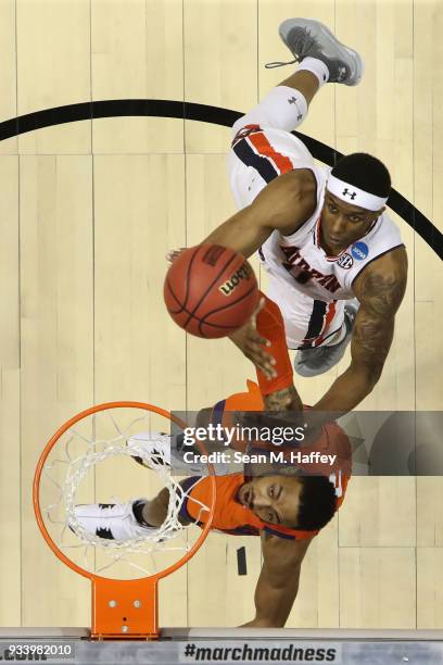 Horace Spencer of the Auburn Tigers shoots against Marcquise Reed of the Clemson Tigers during the second round of the 2018 NCAA Men's Basketball...