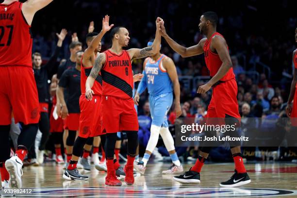 Shabazz Napier of the Portland Trail Blazers and Maurice Harkless of the Portland Trail Blazers celebrate during the fourth quarter of the game...