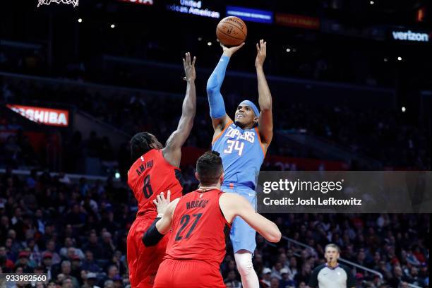 Tobias Harris of the LA Clippers shoots over Al-Farouq Aminu of the Portland Trail Blazers during the second half of the game at the Staples Center...