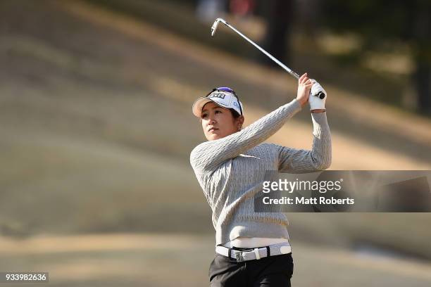 Asako Fujimoto of Japan plays her approach shot on the 18th hole during the second round of the T-Point Ladies Golf Tournament at the Ibaraki Kokusai...