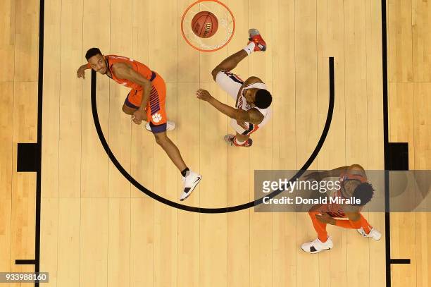 Marcquise Reed of the Clemson Tigers watches his shot against Malik Dunbar of the Auburn Tigers during the second round of the 2018 NCAA Men's...