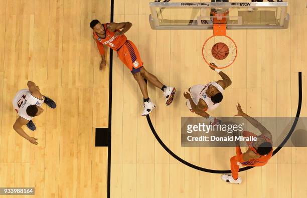 Marcquise Reed of the Clemson Tigers watches his shot against Malik Dunbar of the Auburn Tigers during the second round of the 2018 NCAA Men's...