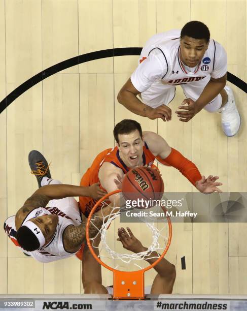David Skara of the Clemson Tigers shoots against Shelton Mitchell of the Auburn Tigers during the second round of the 2018 NCAA Men's Basketball...