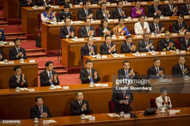 Wang Huning, member of the Communist Party of China's Politburo Standing Committee, second row from left, Li Zhanshu, chairman of the National...