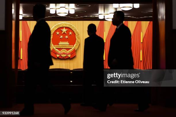 General view shows the coat of arms of the People's Republic of China displayed in the Great Hall of the People before the seventh plenary session of...