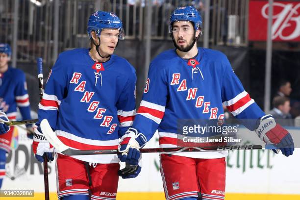 Mika Zibanejad and Vladislav Namestnikov of the New York Rangers talk during a break in the action against the Carolina Hurricanes at Madison Square...