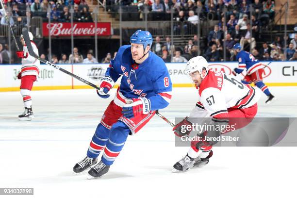 Cody McLeod of the New York Rangers skates against Trevor van Riemsdyk of the Carolina Hurricanes at Madison Square Garden on March 12, 2018 in New...